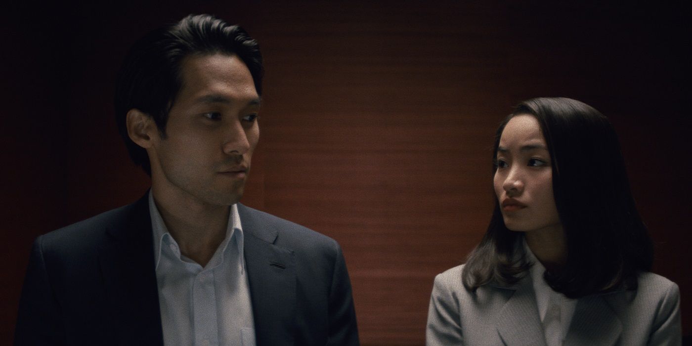 Jin Ha and Anna Sawai, standing in an elevator, as Solomon Baek and Naeomi in Pachinko Season 2