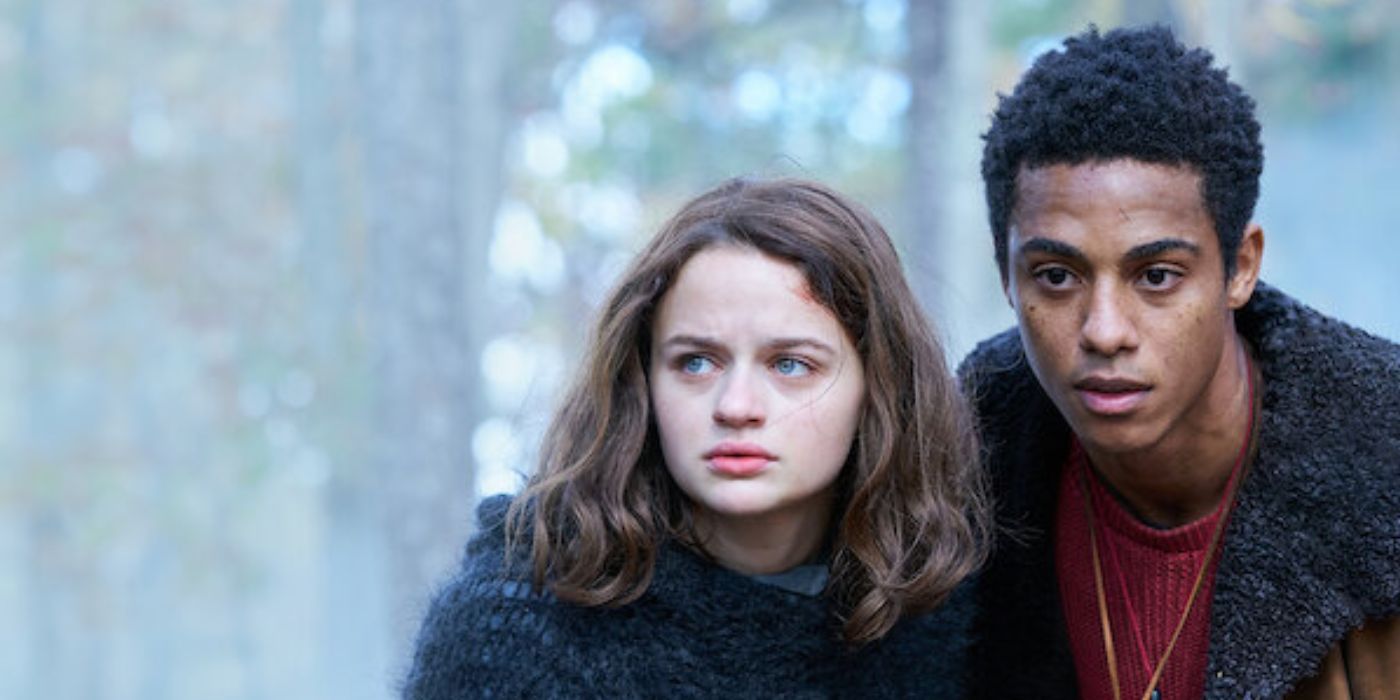 Joey King standing next to Keith Powers in the middle of the woods in 'Uglies'.