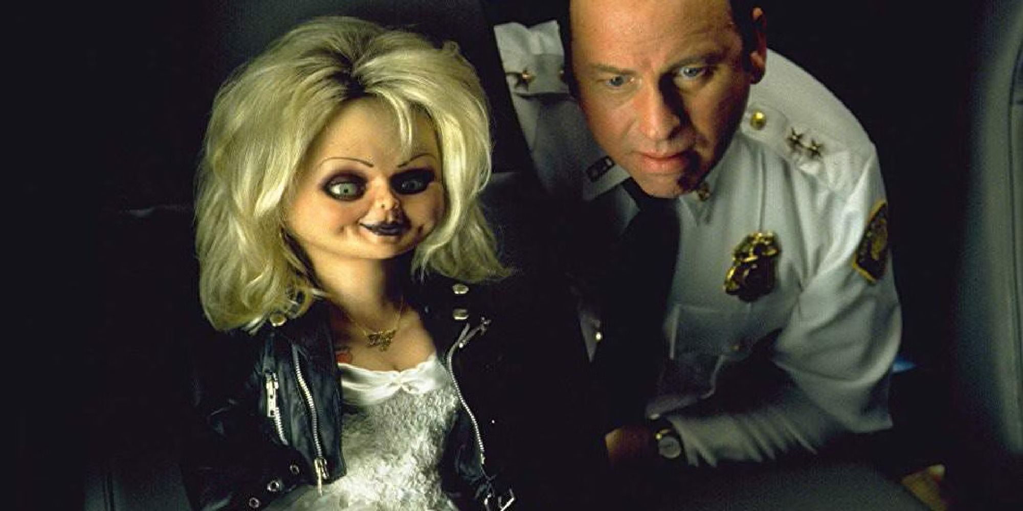 John Ritter and Jennifer Tilly (in doll form as Tiffany) in 'Bride of Chucky'