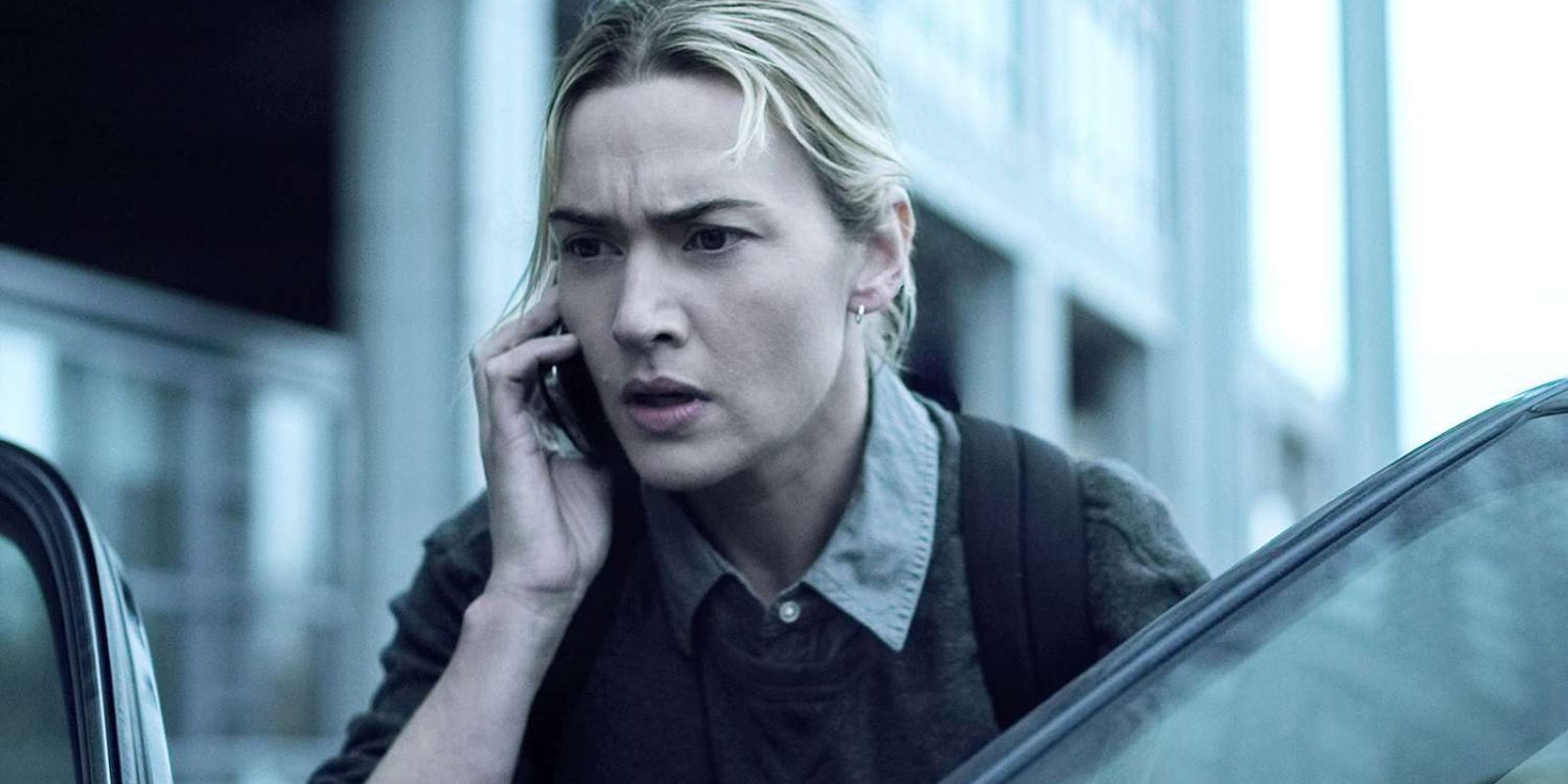 Erin Mears on a phone about to go into a car in Contagion