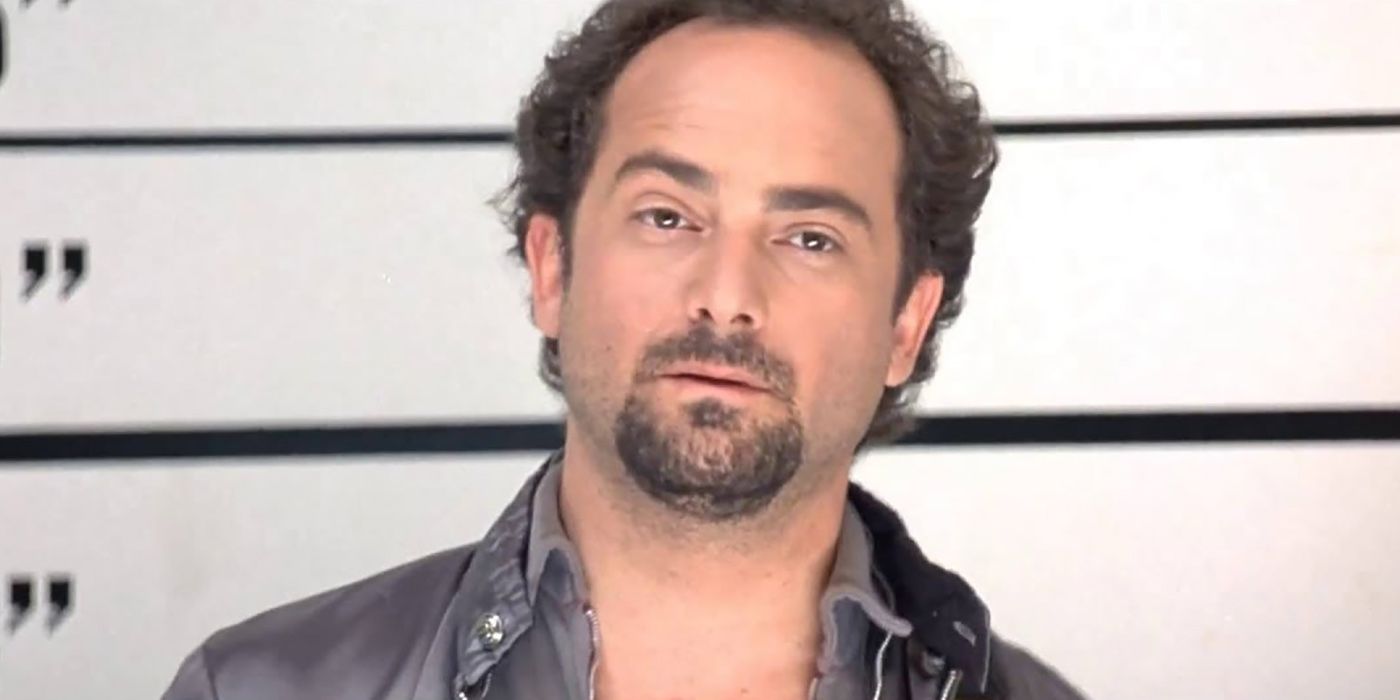 Kevin Pollak standing in a police line-up in a scene from The Usual Suspects