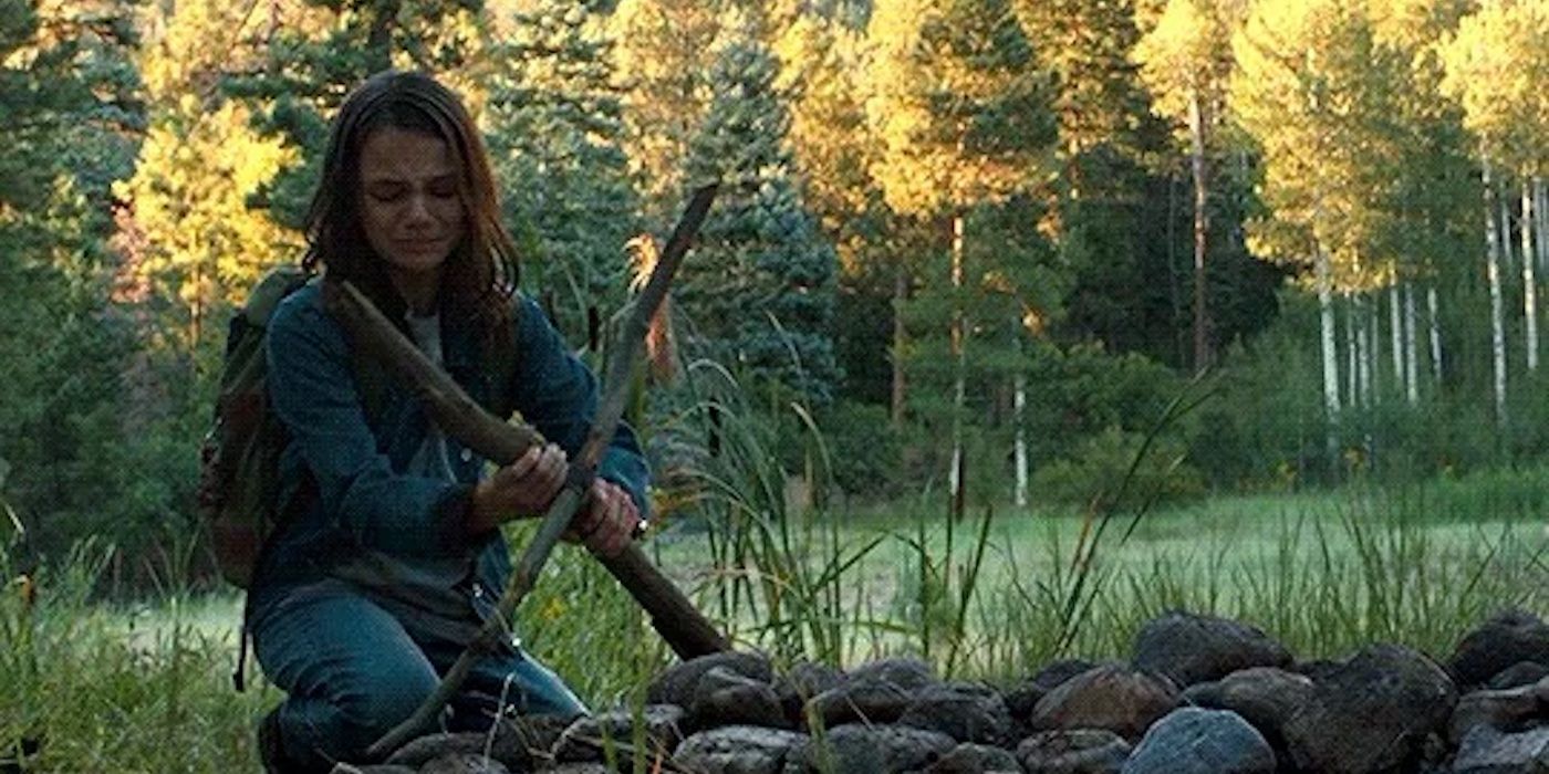 Laura (Dafne Keen) lays Logan (Hugh Jackman) to rest in 'Logan'