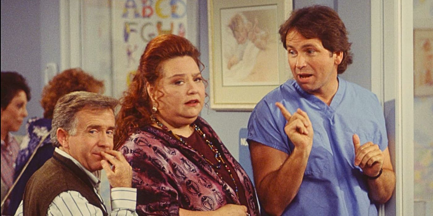 Leslie Jordan and Conchata Ferrell look at something off-screen while John Ritter wags a disapproving finger at them from the 90s sitcom Hearts Afire 