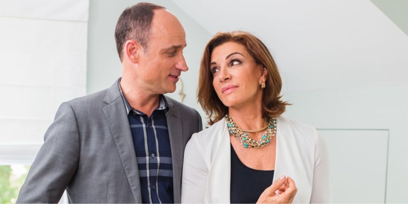 &lsquo;Love It or List It&rsquo; stars Hilary Farr and David Visentin stand close inside a house and look at each other.