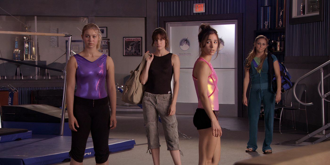 Ayla Kell as Payson Keeler, Chelsea Hobbs as Emily Kmetko, Josie Loren as Kaylie Cruz and Cassie Scerbo as Lauren Tanner dressed in practice attire in their gymnastics gym in Make It or Break It.