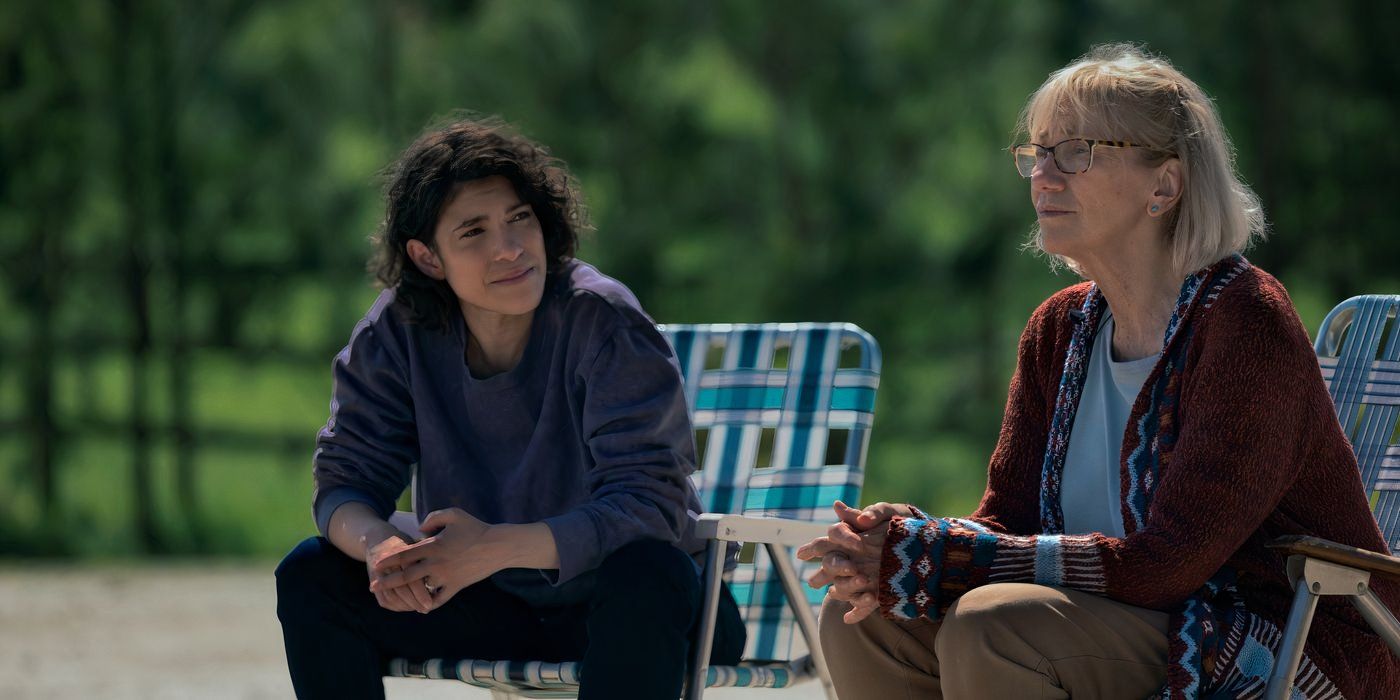 two women sit on blue and white lawn chairs and have a discussion in 'teacup'