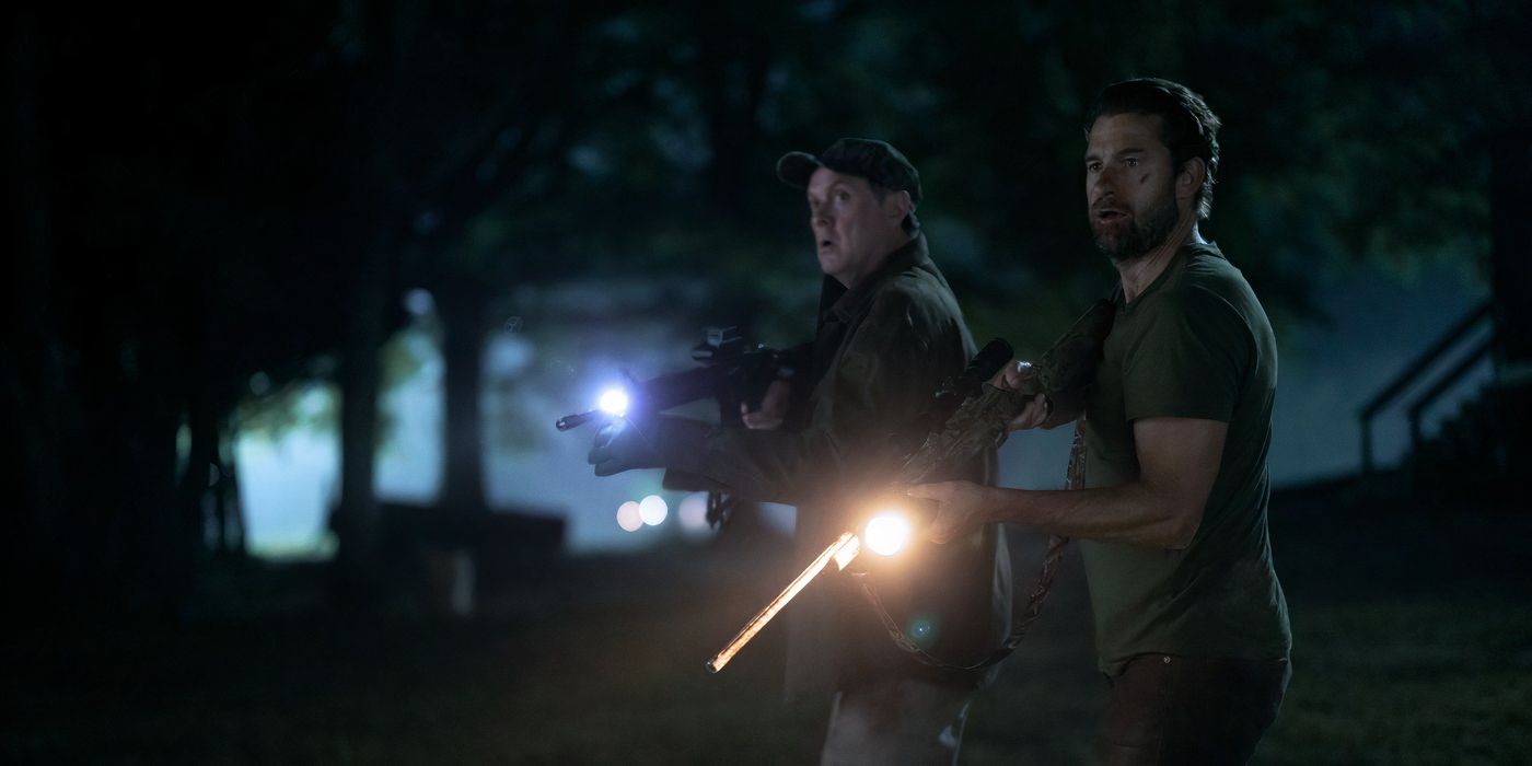 two men stand in the dark holding guns with flashlights in 'teacup'