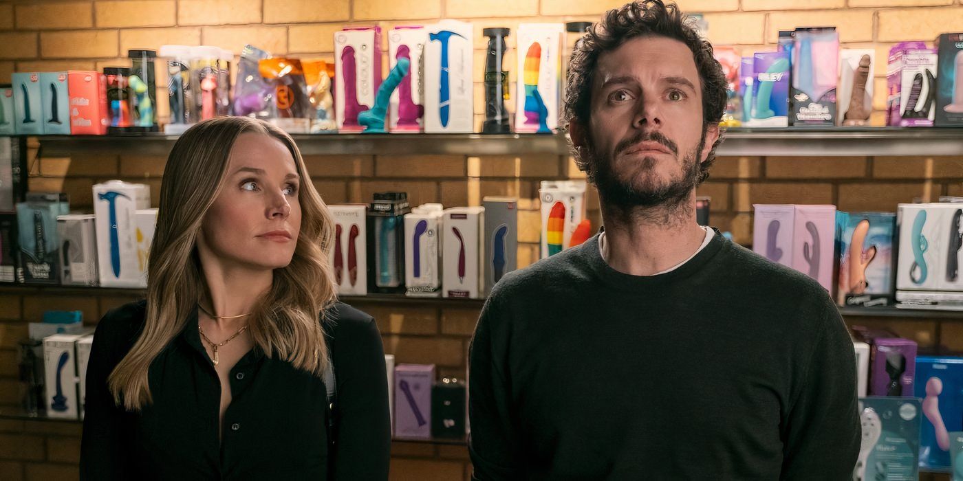 kristen bell and adam brody stand side by side in a sex shop