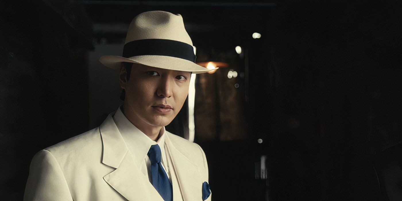 Hansu (Lee Minho) wears a white suit and hat in 'Pachinko'