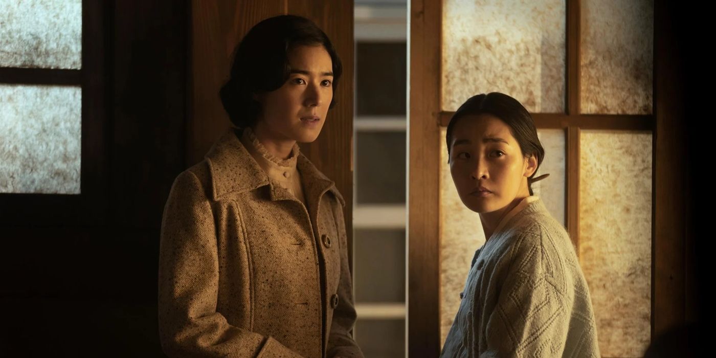 Kyunghee and Sunja look on with concern in a scene from 'Pachinko.'