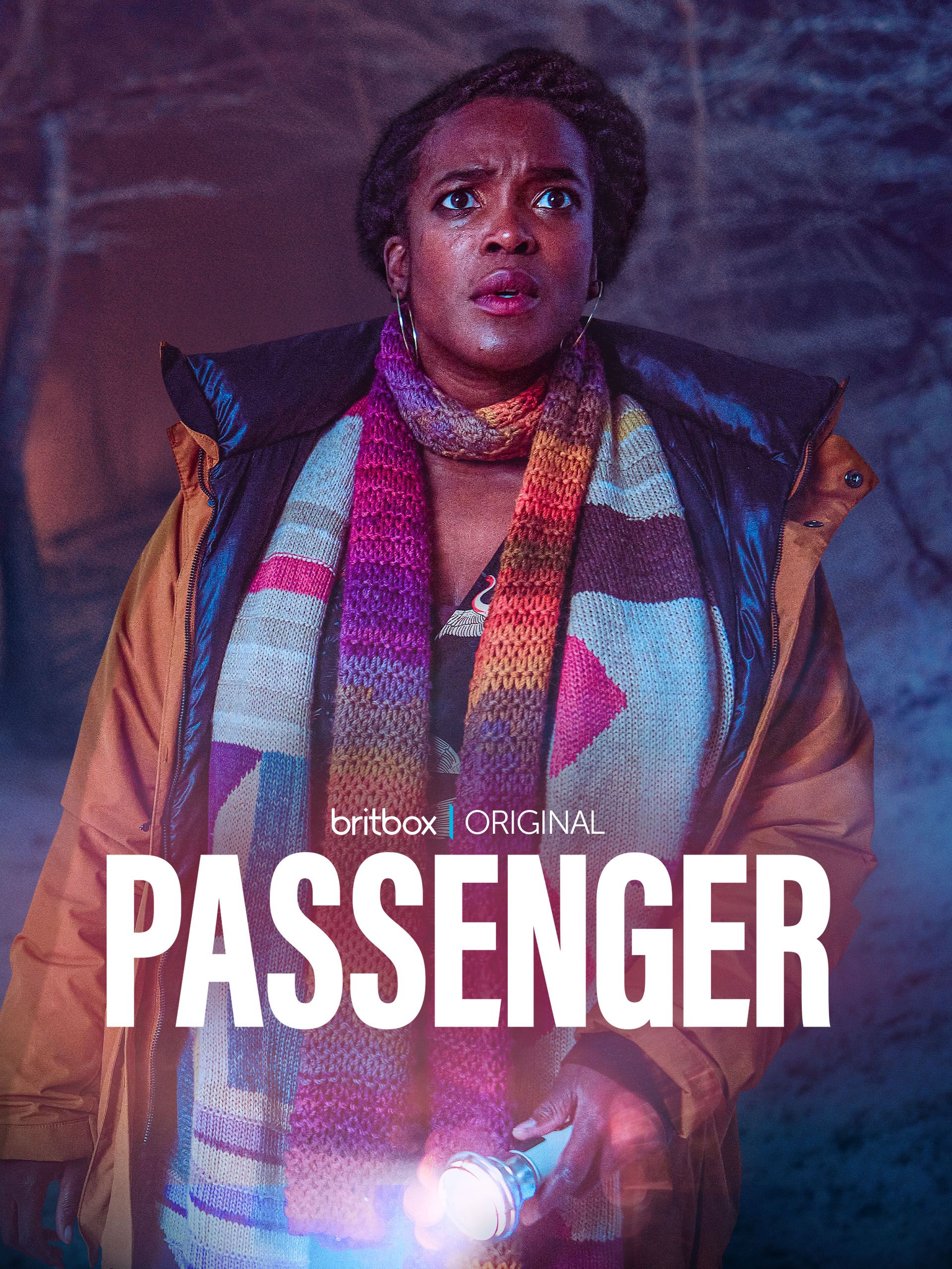 Wunmi Mosaku holds a flashlight on the poster for the BritBox original Passenger