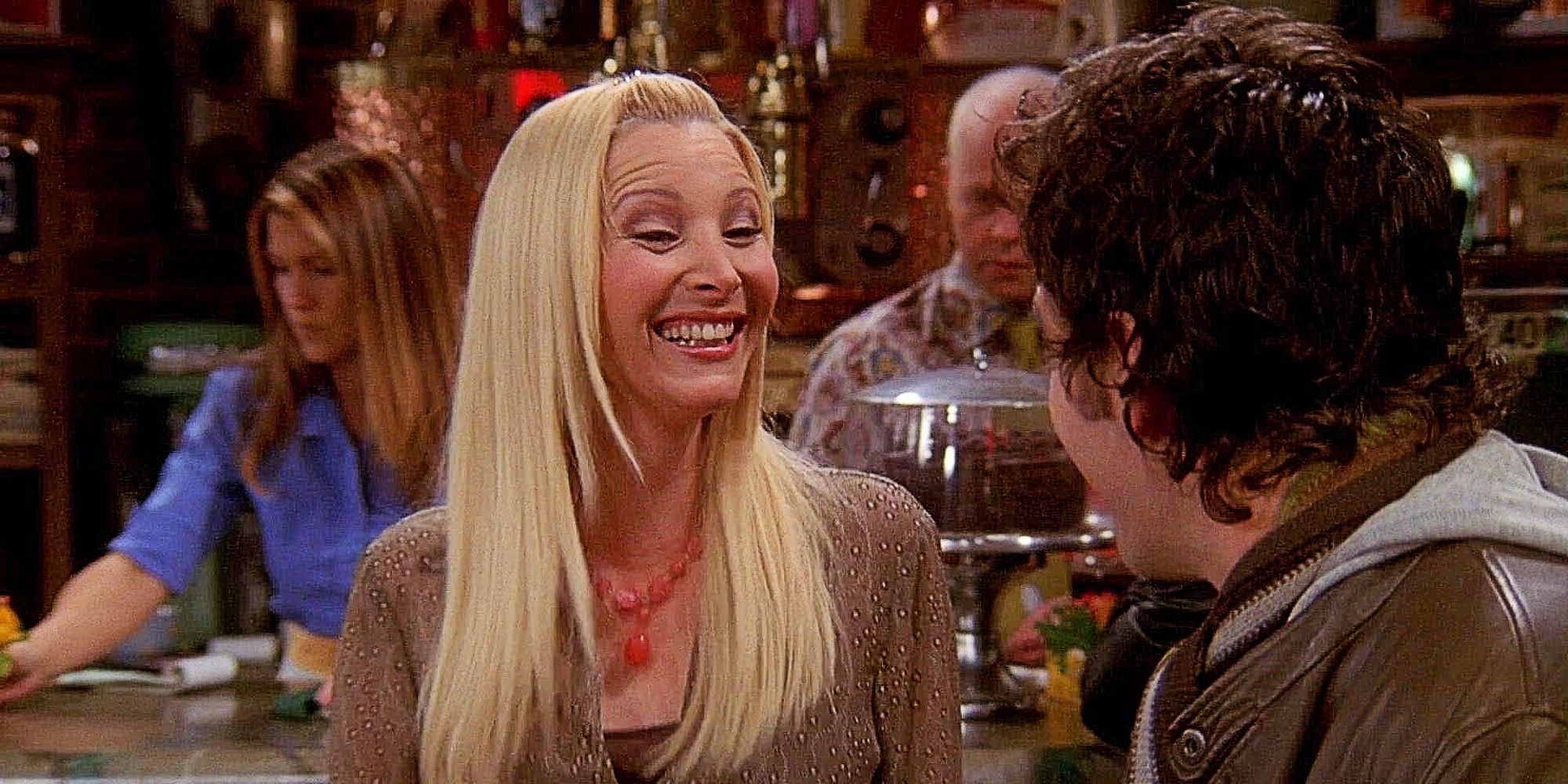 Phoebe and Mike smiling at each other in Friends Season 10