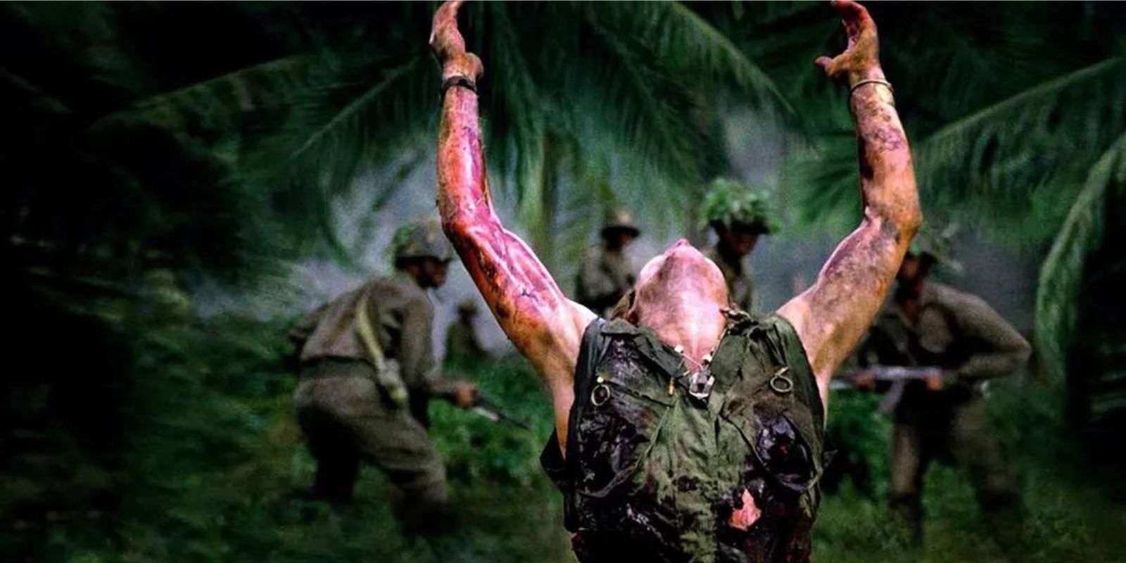 A soldier raising his arms at the jungle in Platoon 1986