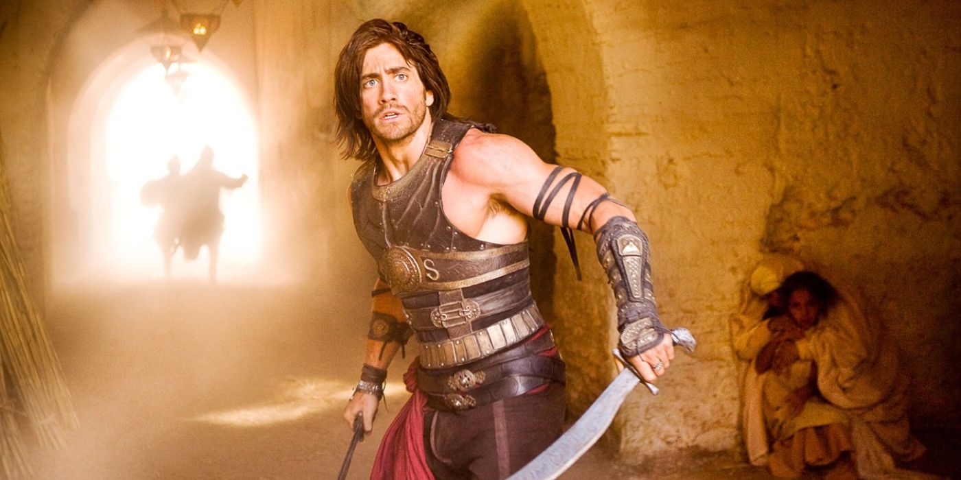 Prince Dastan (Jake Gyllenhaal) runs through the streets of a fort armed with two swords in 'Prince of Persia: The Sands of Time' (2010).