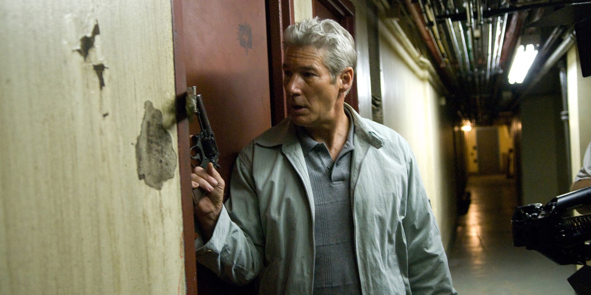 Officer Eddie Dugan with a gun outside an apartment in 'Brooklyn's Finest'