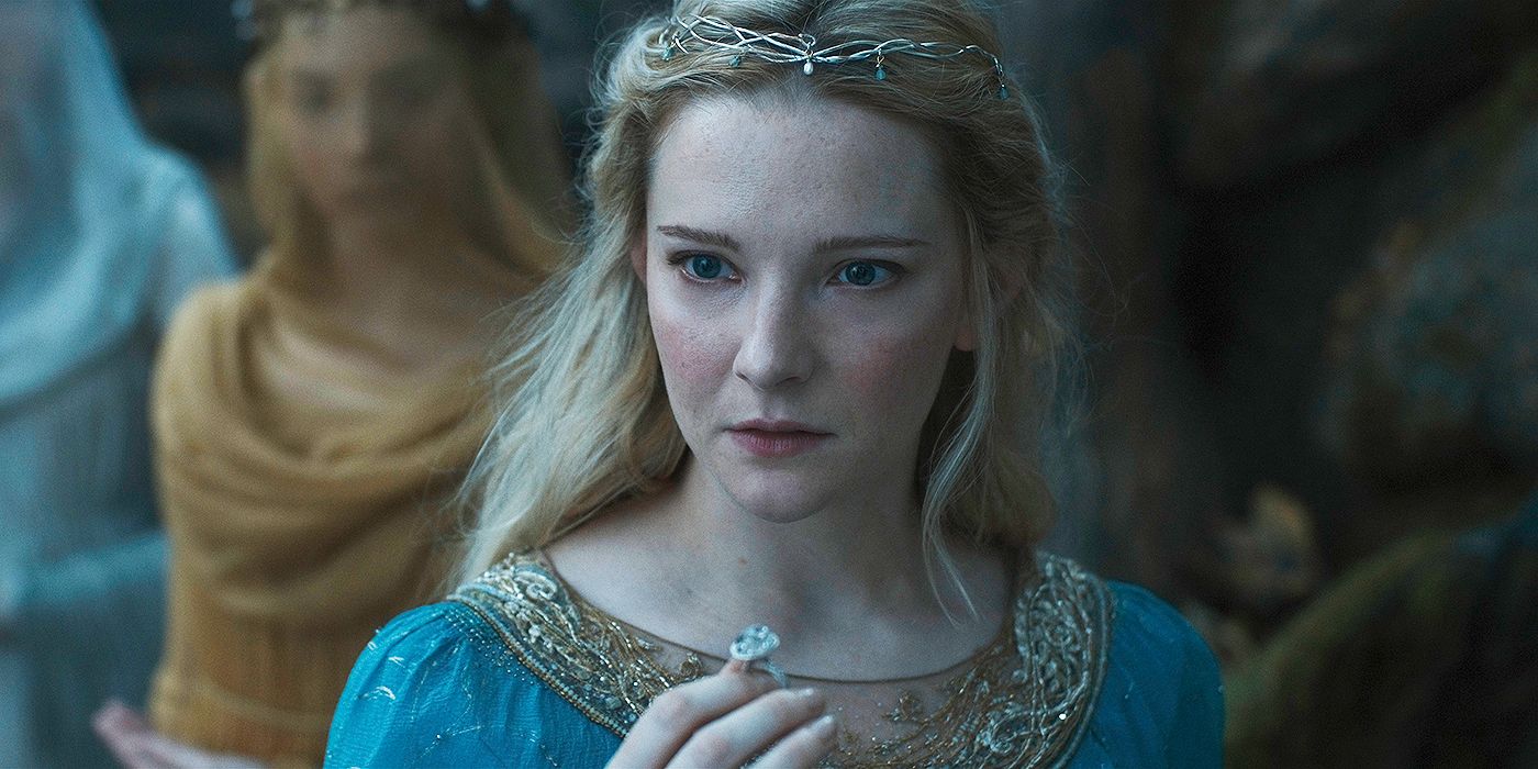 Morfydd Clark as Galadriel holding her ring Nenya and looking shocked in The Lord of the Rings: The Rings of Power Season 2