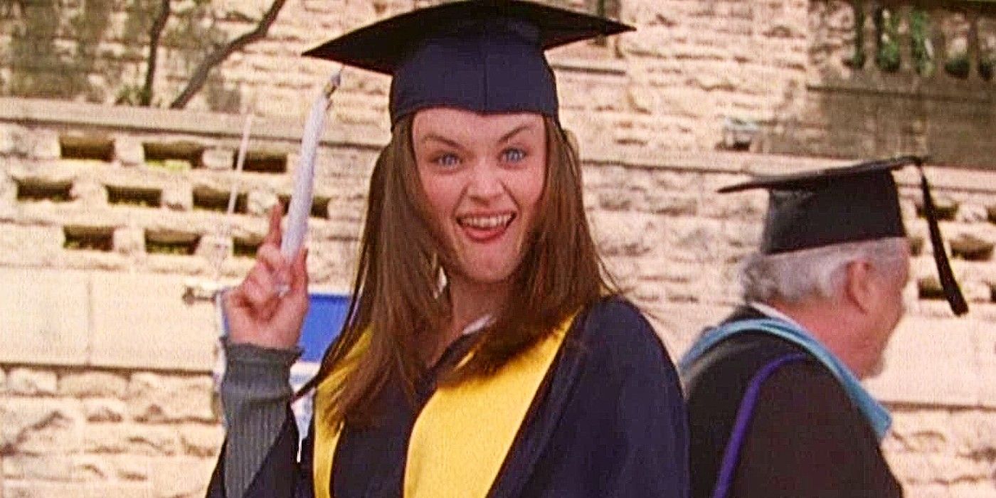 Rory Gilmore in her cap and gown sticking her tongue out at graduation in Gilmore Girls