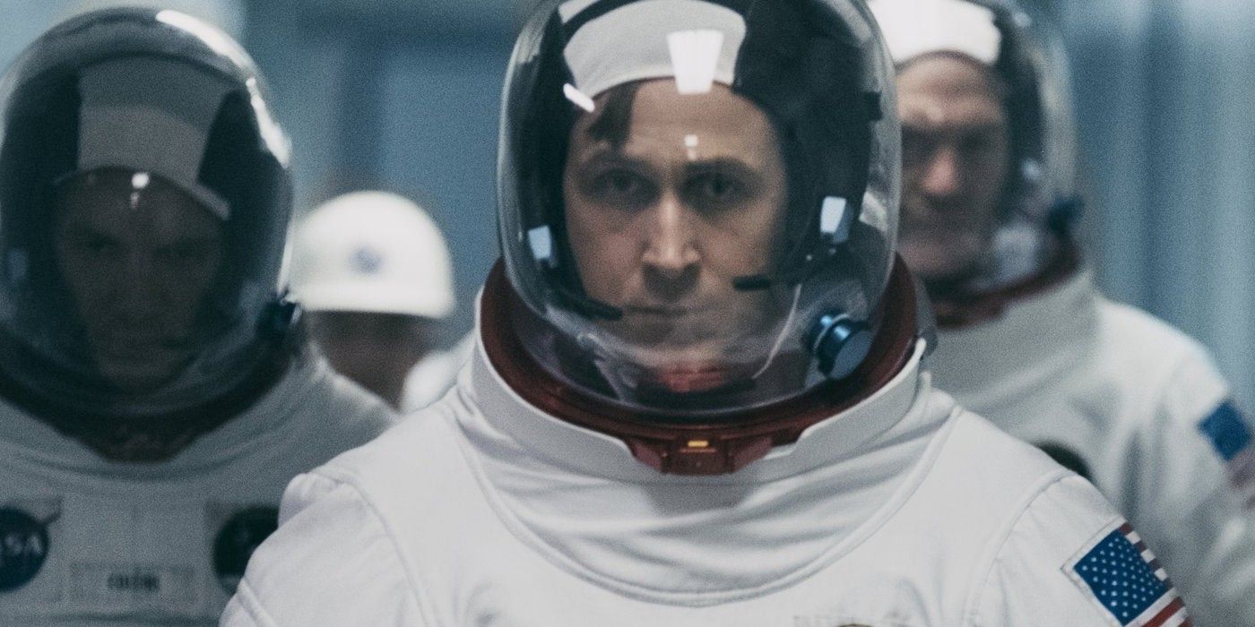 Neil Armstrong in his space suit walking with other astronauts in First Man