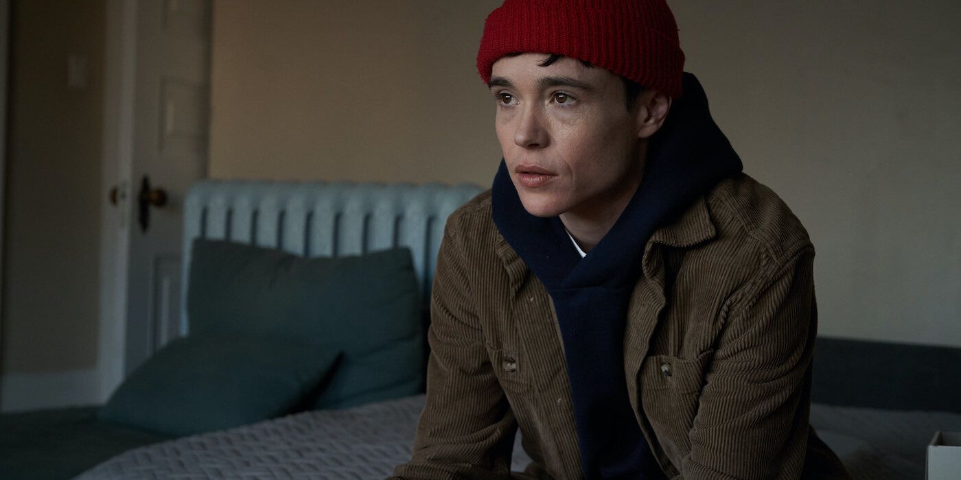 Elliot Page as Sam sitting in a room with a red hat looking outwards in Close to You. 