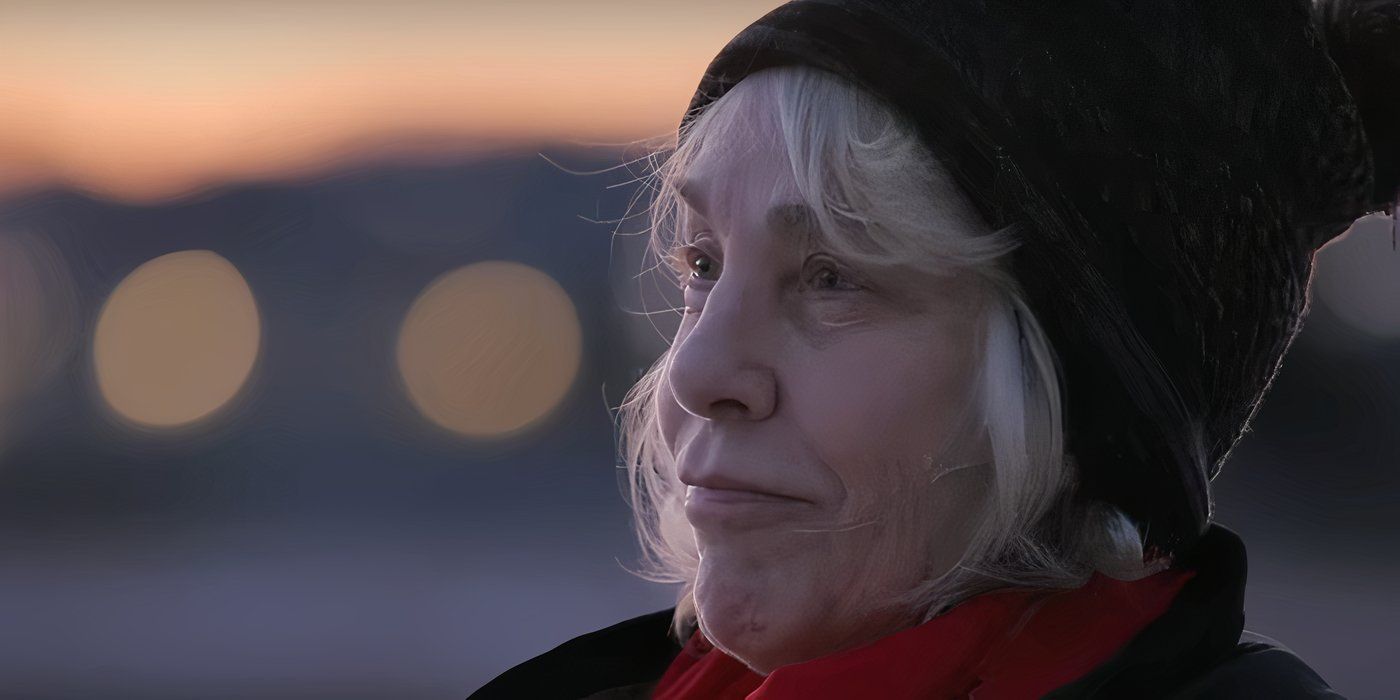 Cathy Terkanian wears a black beanie and a red scarf as she looks for her daughter