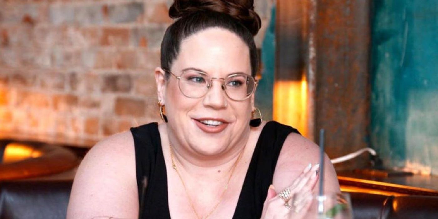 Whitney Way Thore sits in a cafe and looks at someone off-camera in My Big Fat Fabulous Life.
