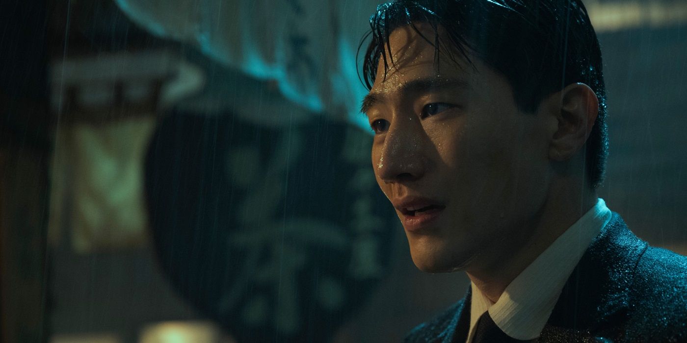 Steve Sanghyun Noh, drenched in the rain, as Baek Isak in Pachinko