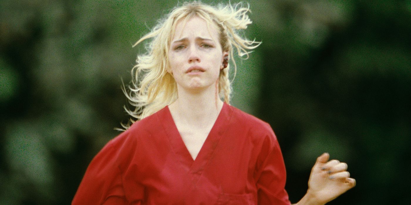 Willa Fitzgerald crying runs towards the camera in a red shirt in Strange Darling.