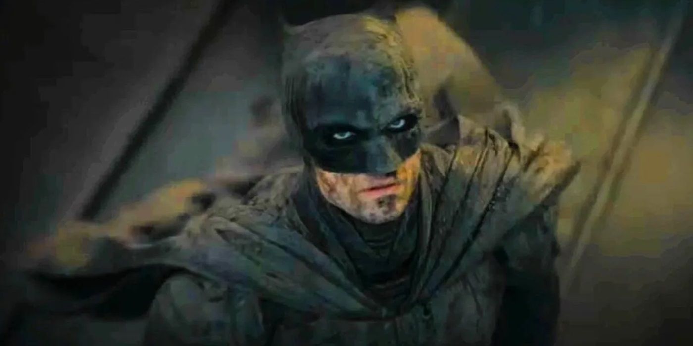 Robert Pattinson as Batman looking up in The Batman