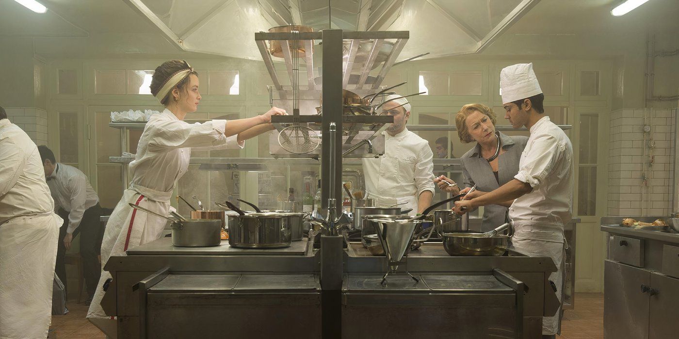 Two chefs stand opposite to each other in the kitchen of Le Saule Pleureur in The Hundred-Foot Journey