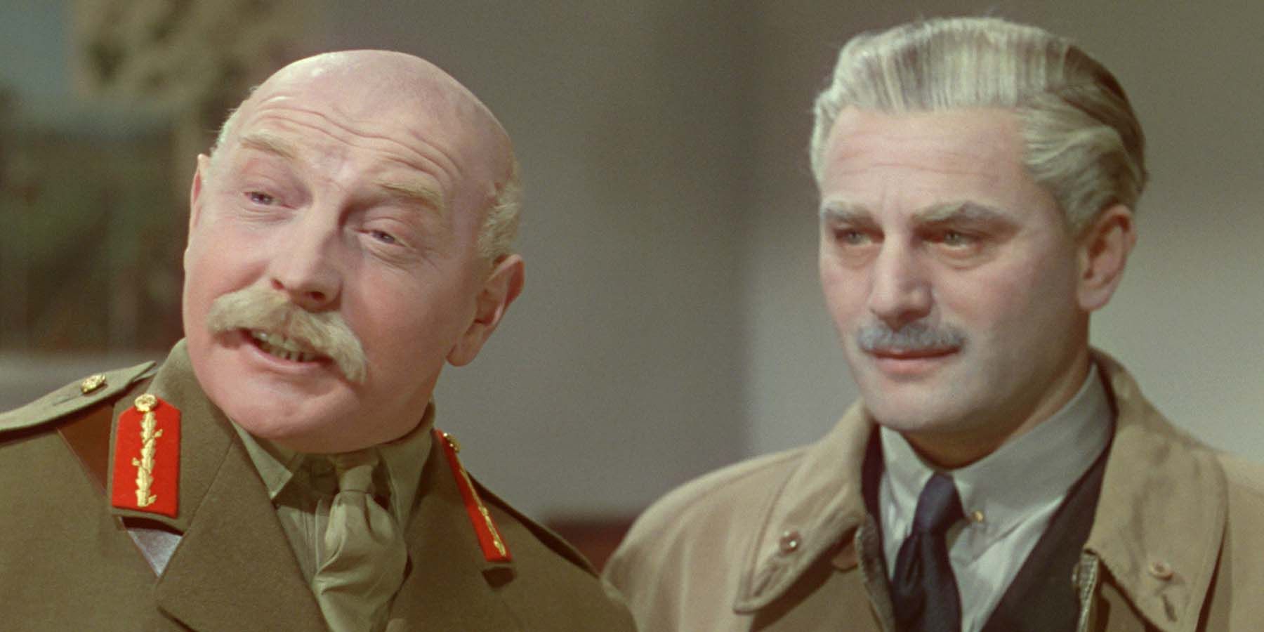Roger Livesey and Anton Walbrook talk to someone off camera in The Life and Death of Colonel Blimp