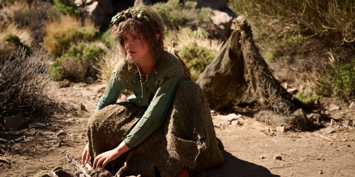 Markella Kavenaugh sitting in a desert in The Rings of Power Season 2