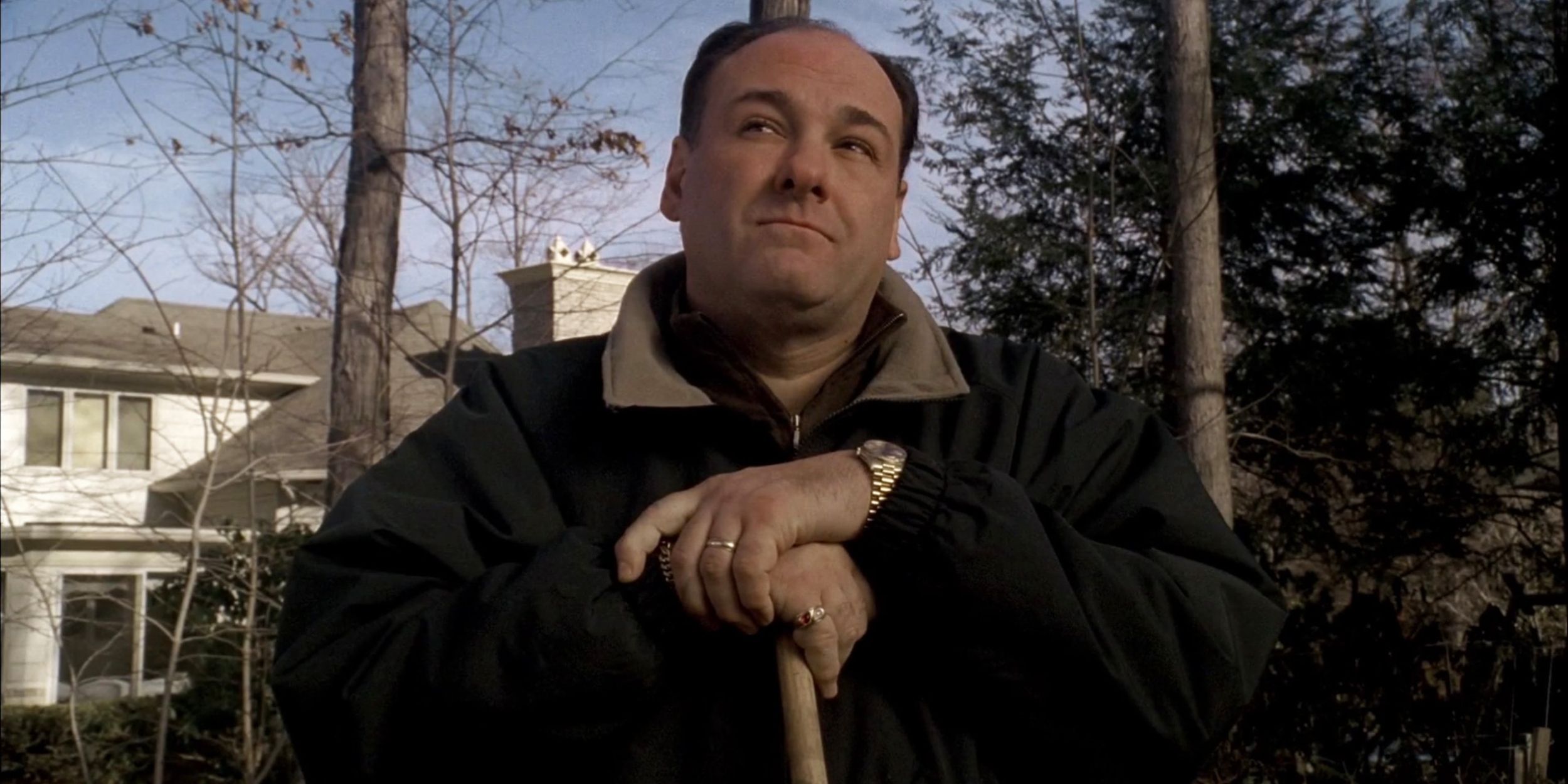 Tony Soprano with his hands on a broomstick looking to the distance in 'The Sopranos' episode "Made in America"