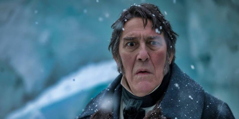 Ciaran Hinds looking horrified in the snow in The Terror Season 1