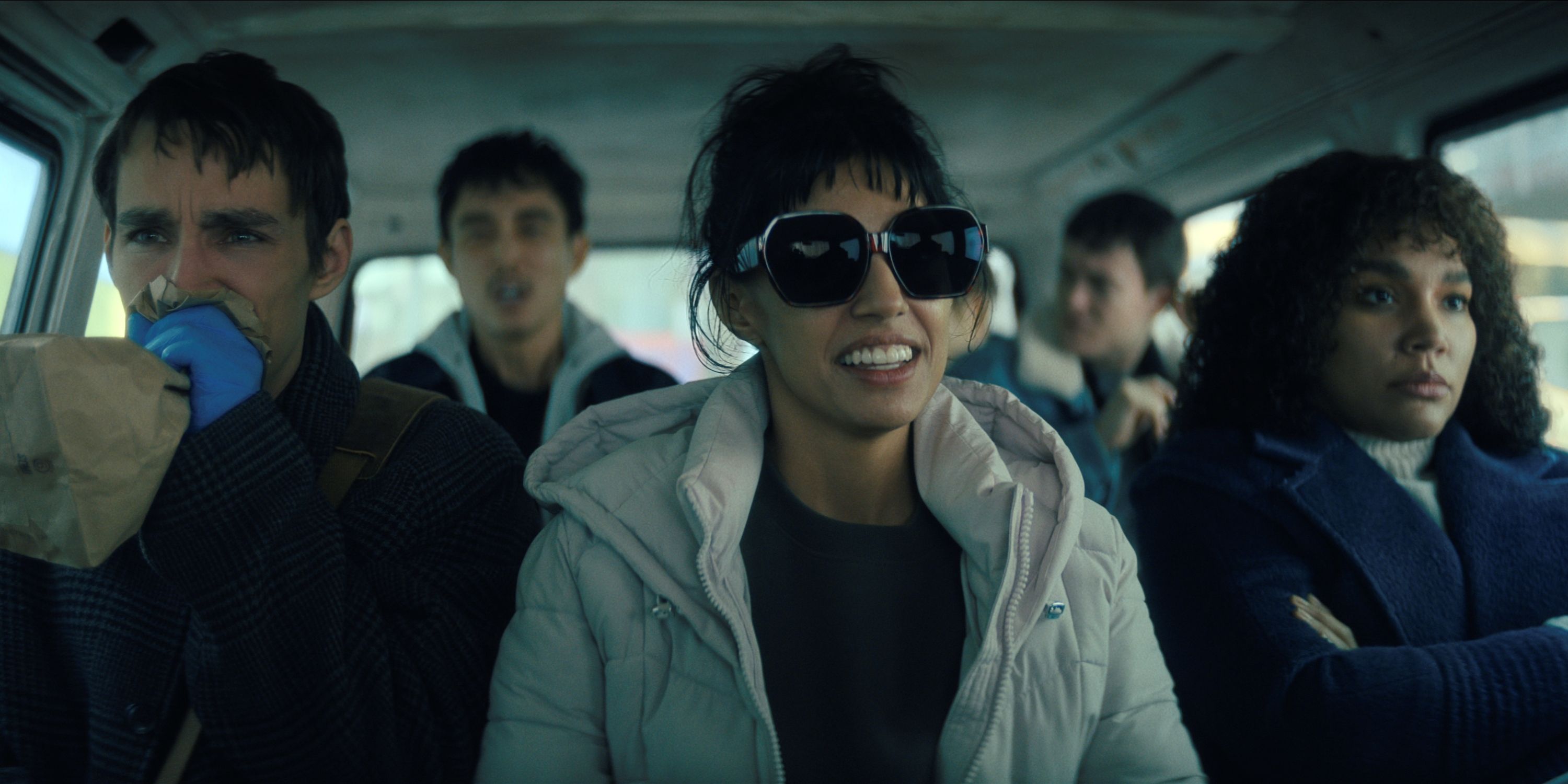 Robert Sheehan, Ritu Arya and Emmy Raver-Lampman sitting in the front seat of a car in The Umbrella Academy