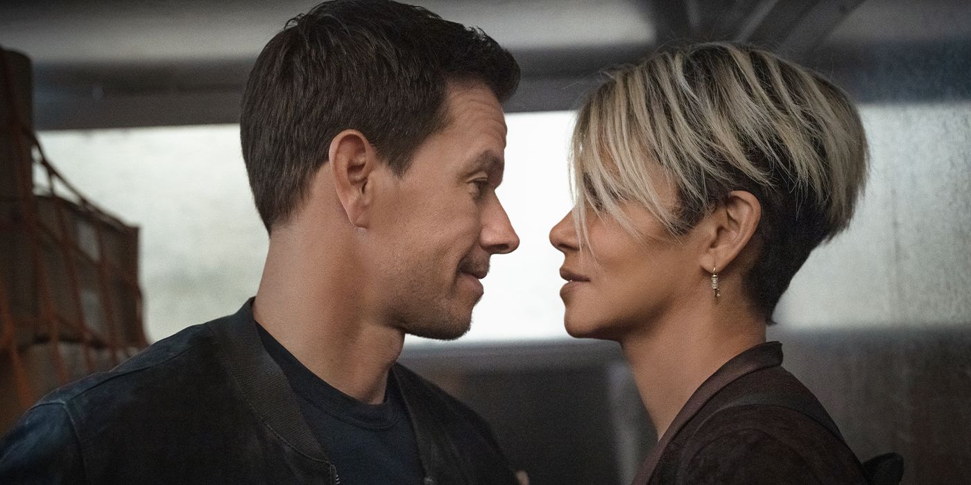 Mark Wahlberg and Halle Berry standing close with their faces inches apart