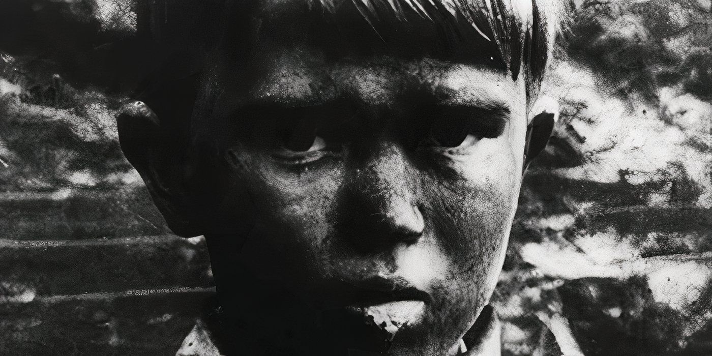 Close-up of a young boy looking at the camera in The War Game