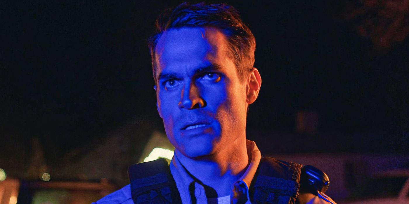 Jim Cummings as John Marshall standing in blue lighting in &lsquo;The Wolf of Snow Hollow&rsquo;
