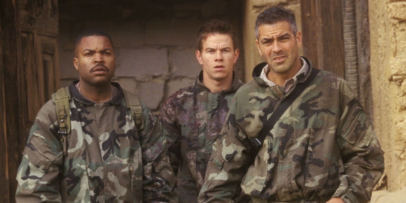 George Clooney as Archie, Mark Wahlberg as Troy, and Ice Cube as Elgin staring ahead in Three Kings