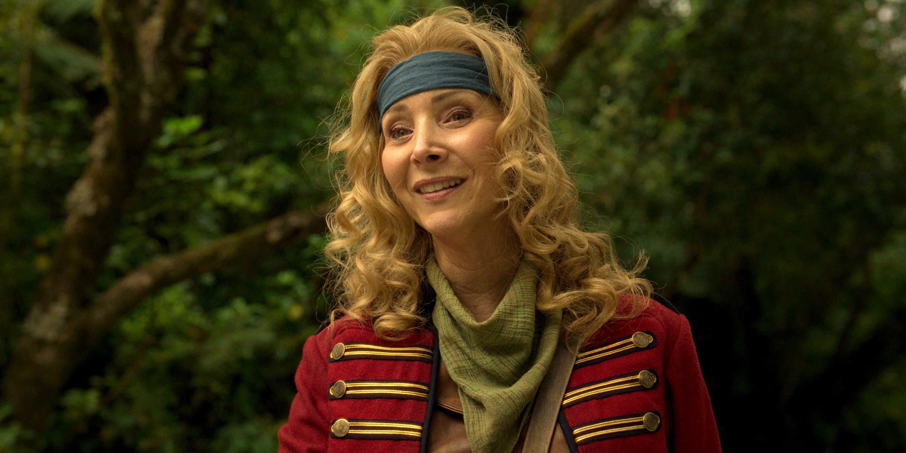 Lisa Kudrow as Penelope wearing a green headband and red military coat in Time Bandits