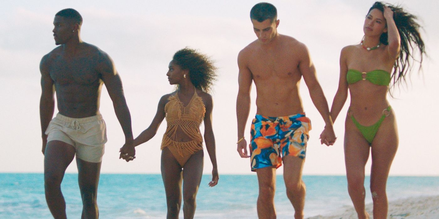 Demari Davis and Bri Balram hold hands walking beside Charlie Jeer and Katherine LaPrell on the beach on 'Too Hot to Handle'