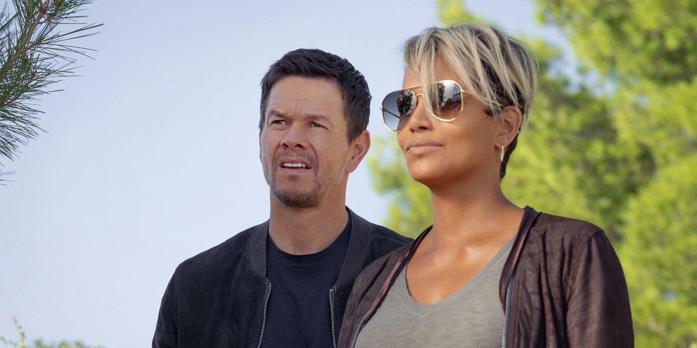 Halle Berry and Mark Wahlberg as Roxanne and Mike, standing outside and looking off into the distance in Netflix's The Union