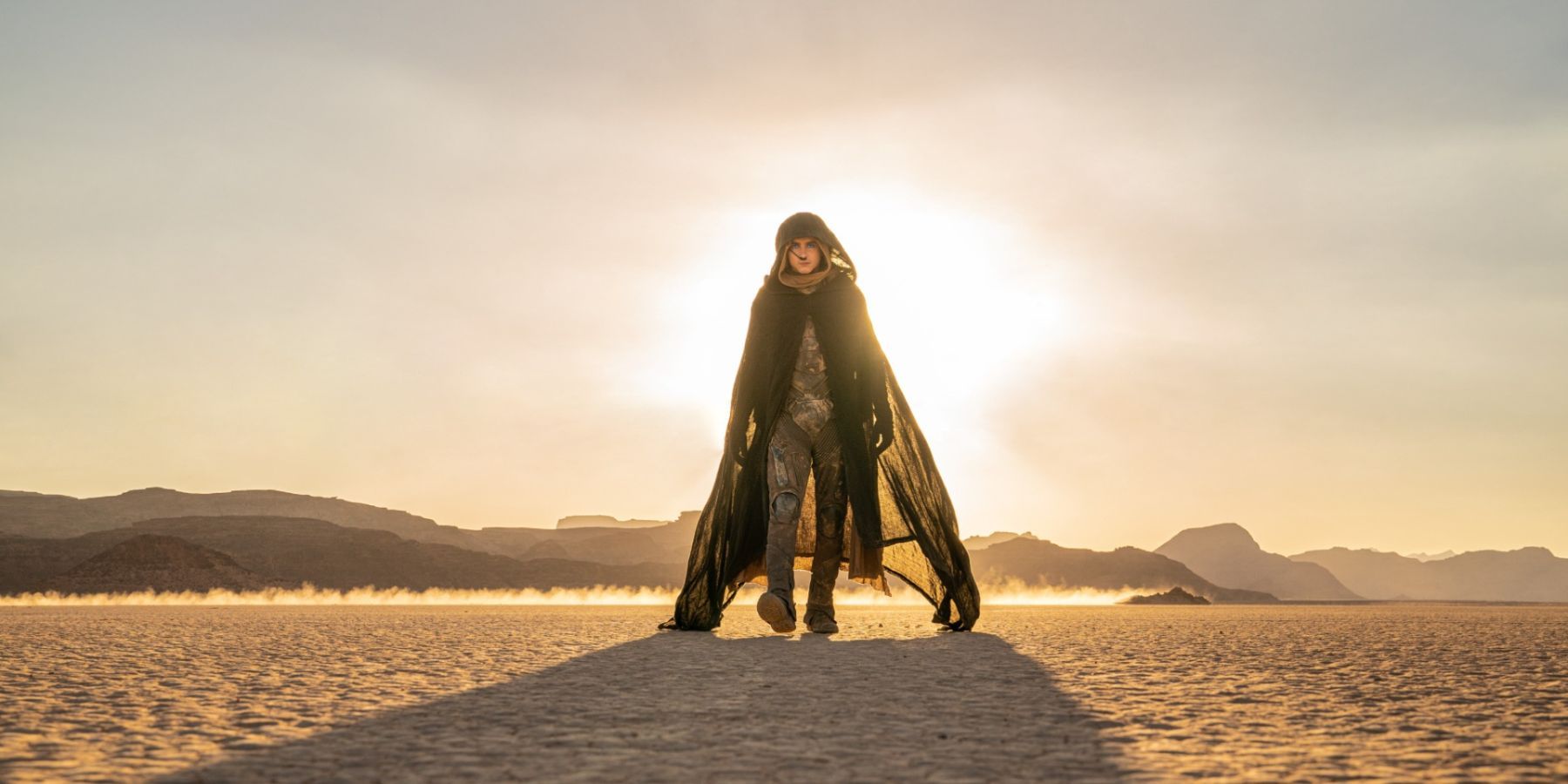 Timothee Chalamet walking through the desert of Arakis in Dune Part 2.