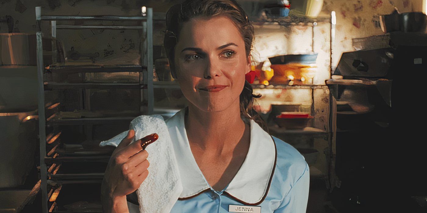 Jenna stands inside a restaurant kitchen staring off camera and smiling slightly in Waitress.