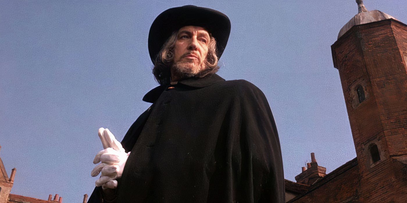 Matthew Hopkins looking down at something in 'Witchfinder General' 