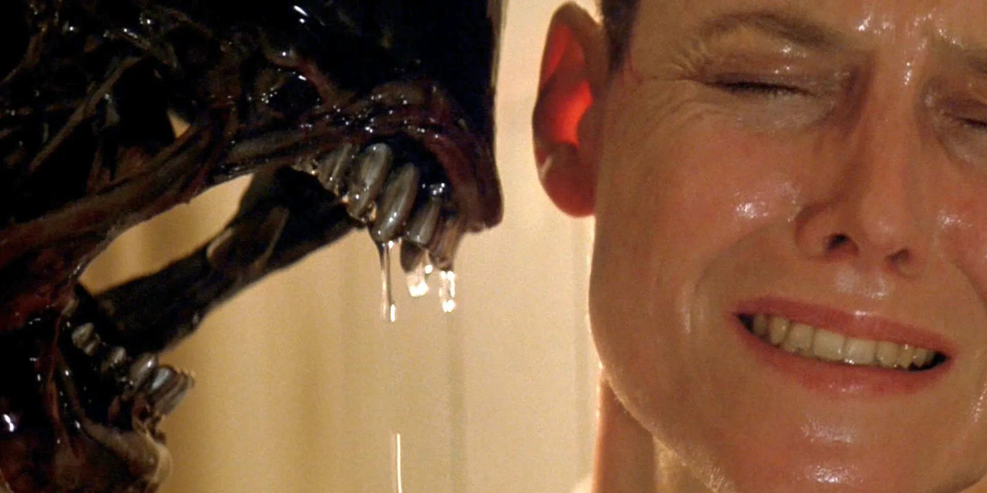 A Xenomorph opens its mouth right next to Ripley's head in 'Alien 3'