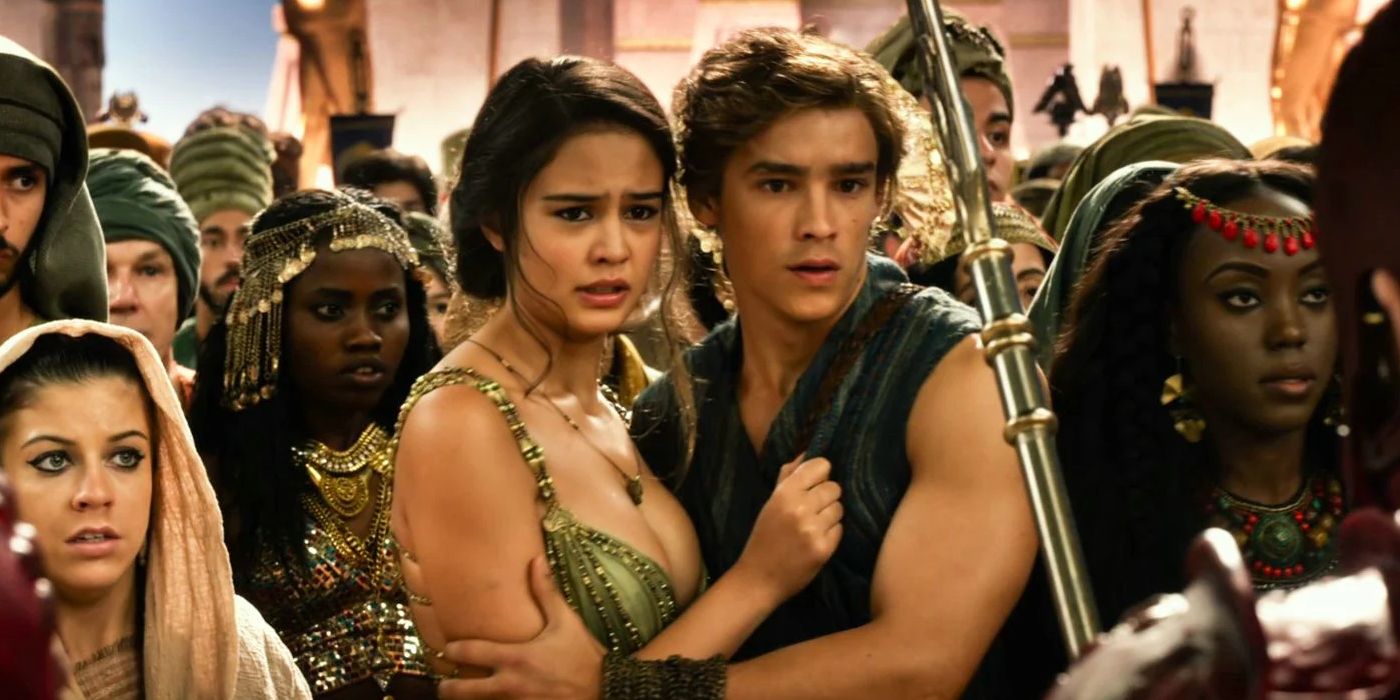 Zaya, played by Courtney Eaton, is embraced by Bek, played by Brenton Thwaites, in a crowd