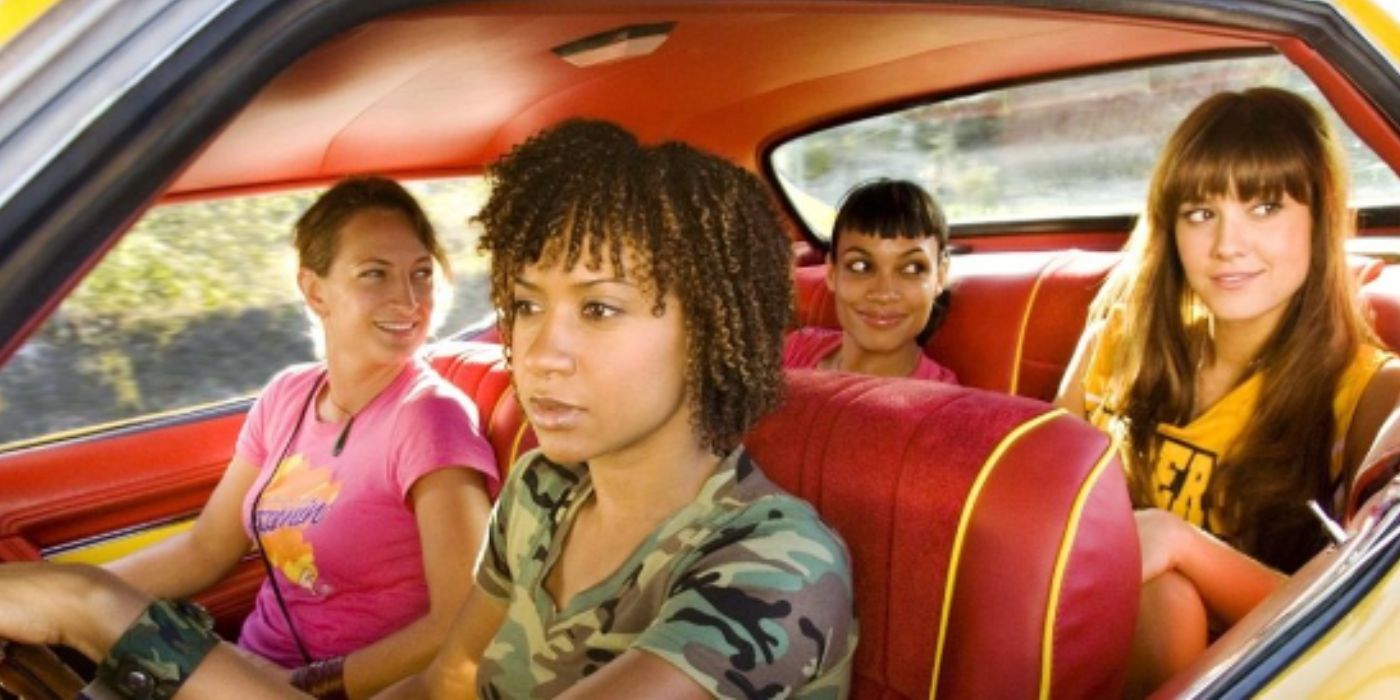 Rosario Dawson, Mary Elizabeth Winstead, Zoe Bell, and Tracie Thoms ride in a car in Death Proof.