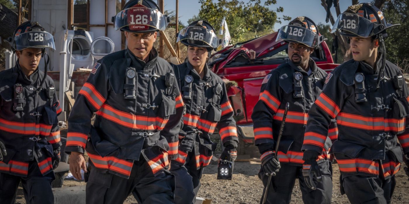 Rob Lowe and the cast dressed in firefighter uniforms arrive on the scene of a car crash in 9-1-1: Lone Star.