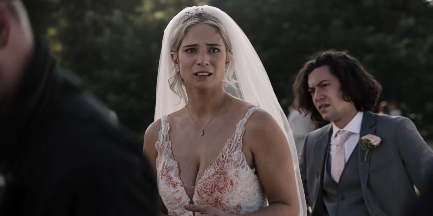 A bride looks concerned and there is a light staining of blood on the top of her dress in 9-1-1: Lone Star.