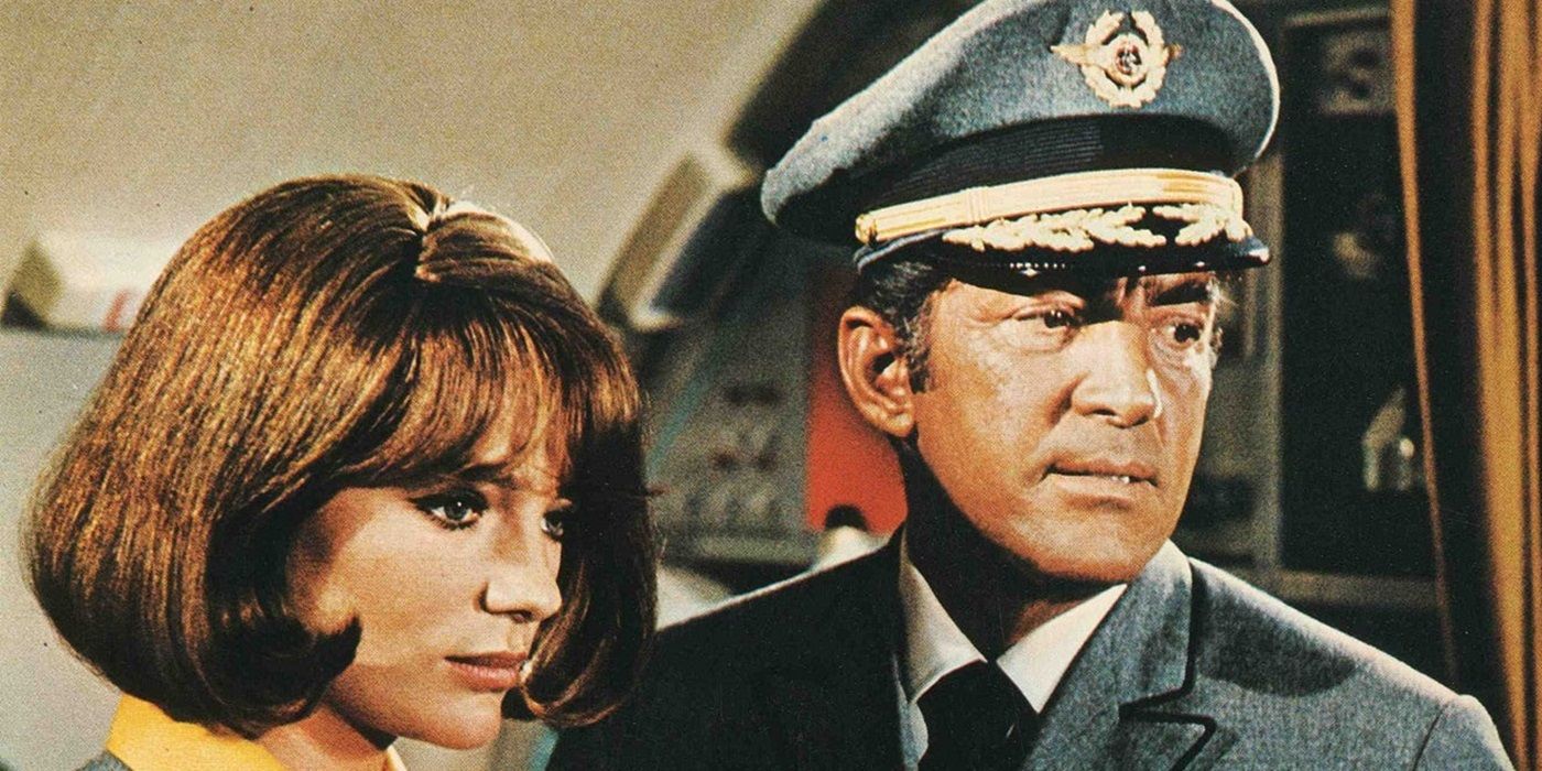 Jacqueline Bisset as Gwen Meighen standing next to Dean Martin as Vernon Demerest in Airport